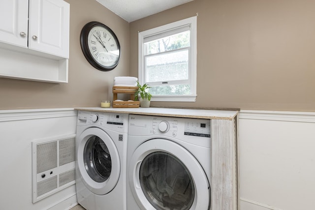 14 Bailey Ln, Brunswick, ME 04011 - laundry area featuring separate washer and dryer, cabinet space, and heating unit