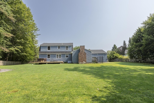 14 Bailey Ln, Brunswick, ME 04011 - fenced backyard with a wooden deck and a storage shed