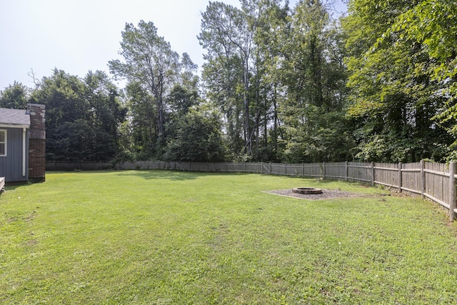 14 Bailey Ln, Brunswick, ME 04011 - fenced backyard with an outdoor fire pit