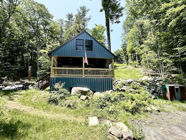 52 Quimby Ln, Fayette, ME 04349 - view of front of property with a porch and a forest view