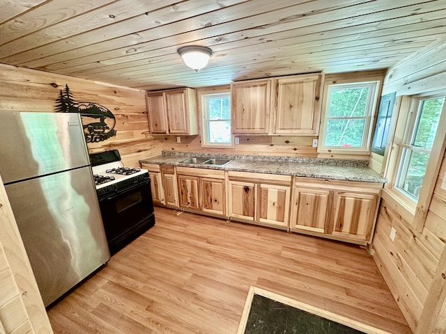 52 Quimby Ln, Fayette, ME 04349 - kitchen featuring freestanding refrigerator, range with gas cooktop, light brown cabinetry, wooden ceiling, and light wood-type flooring