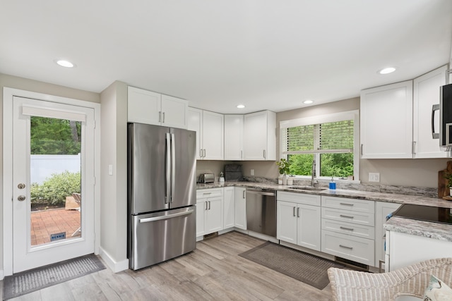 20 Wonderbrook Dr Unit 20, Kennebunk, ME 04043 - kitchen with appliances with stainless steel finishes, plenty of natural light, white cabinets, and recessed lighting