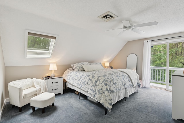 20 Wonderbrook Dr Unit 20, Kennebunk, ME 04043 - carpeted bedroom featuring access to exterior, vaulted ceiling, a ceiling fan, and a skylight