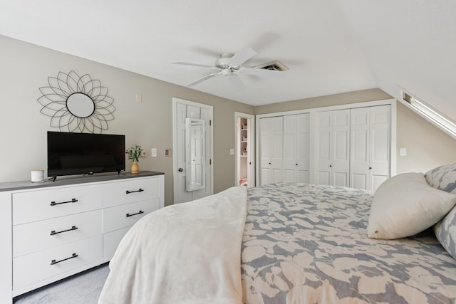 20 Wonderbrook Dr Unit 20, Kennebunk, ME 04043 - carpeted bedroom with two closets, vaulted ceiling, and ceiling fan