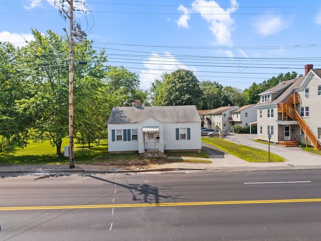 395 Alfred St, Biddeford, ME 04005 - view of front of home featuring a chimney and a residential view