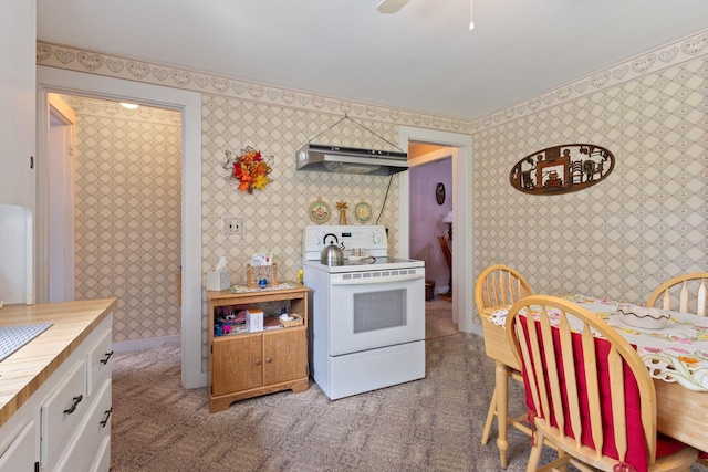 395 Alfred St, Biddeford, ME 04005 - kitchen with wallpapered walls, white electric stove, white cabinets, ventilation hood, and light carpet