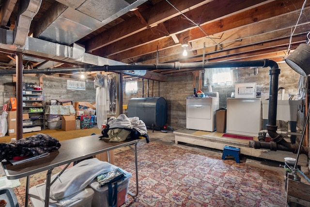 395 Alfred St, Biddeford, ME 04005 - basement featuring washer and clothes dryer and oil tank