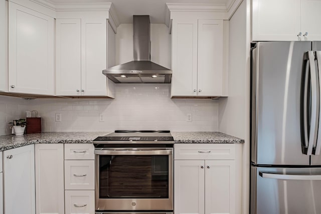 189 Falcon Crest Dr Unit 31, Gorham, ME 04038 - kitchen with appliances with stainless steel finishes, wall chimney range hood, tasteful backsplash, and white cabinetry
