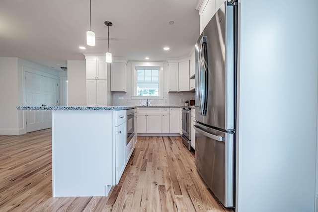 189 Falcon Crest Dr Unit 31, Gorham, ME 04038 - kitchen featuring stainless steel appliances, light wood finished floors, white cabinetry, light stone countertops, and recessed lighting