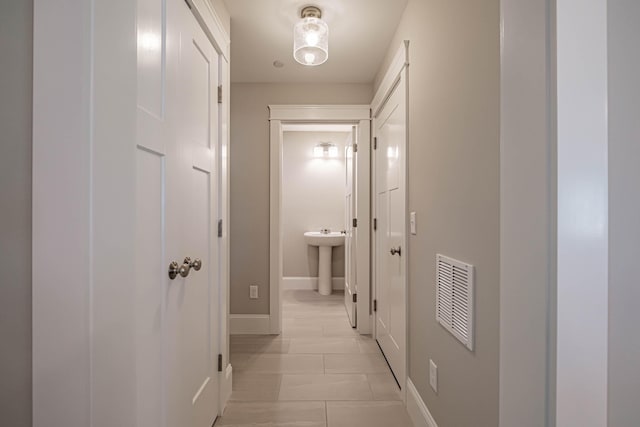 189 Falcon Crest Dr Unit 31, Gorham, ME 04038 - hallway featuring baseboards and light tile patterned floors