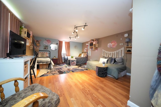 3922 Union St, Levant, ME 04456 - living area featuring light wood finished floors and rail lighting