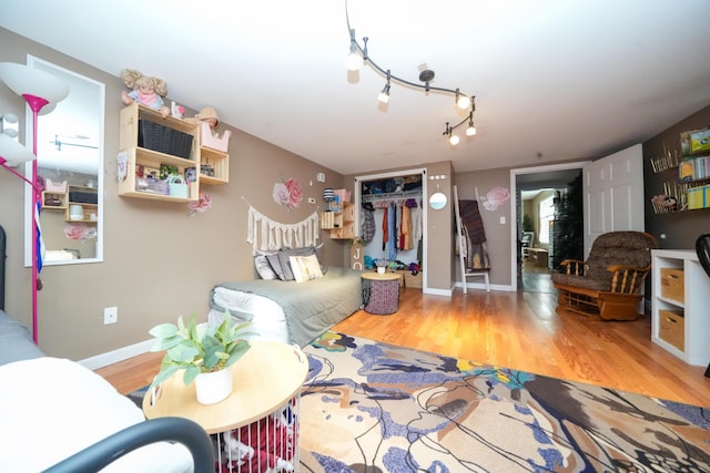 3922 Union St, Levant, ME 04456 - living area featuring wood finished floors and rail lighting