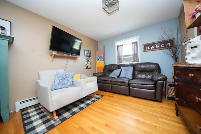 3922 Union St, Levant, ME 04456 - living area with wood finished floors and a baseboard heating unit