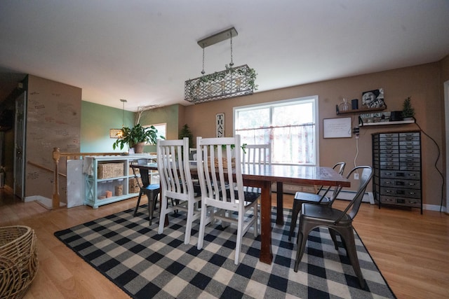 3922 Union St, Levant, ME 04456 - dining room featuring wood finished floors and a baseboard heating unit
