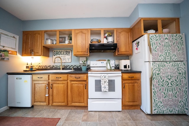3922 Union St, Levant, ME 04456 - kitchen with white appliances, under cabinet range hood, open shelves, brown cabinetry, and dark countertops