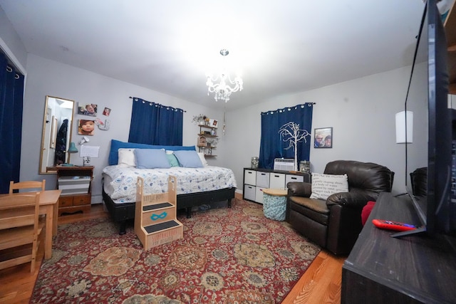 3922 Union St, Levant, ME 04456 - bedroom with wood finished floors and a chandelier