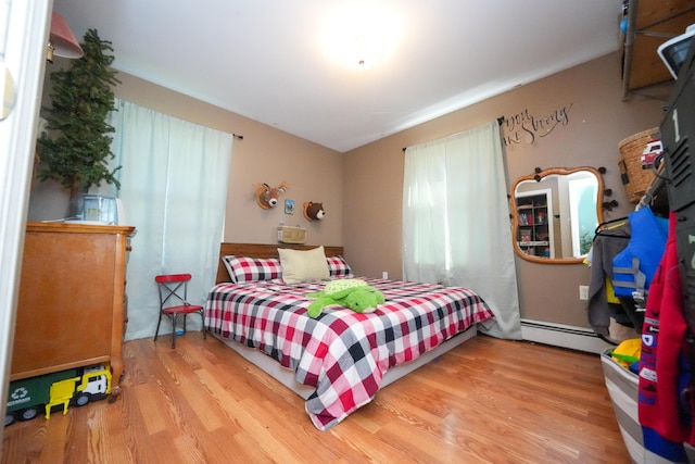 3922 Union St, Levant, ME 04456 - bedroom featuring wood finished floors and a baseboard radiator