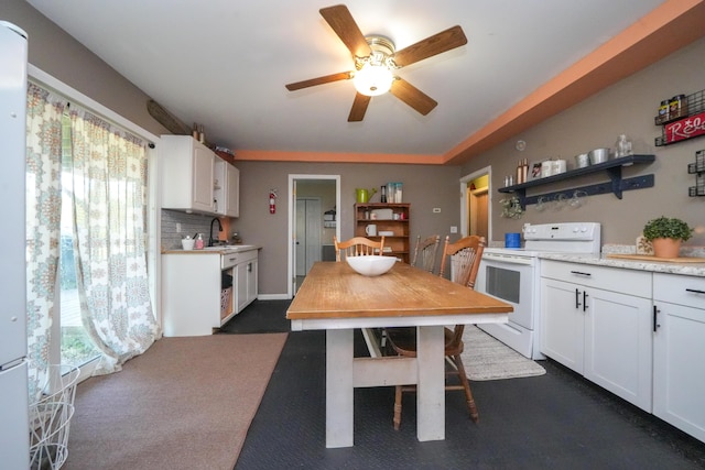 3922 Union St, Levant, ME 04456 - kitchen with white appliances, plenty of natural light, open shelves, and white cabinetry