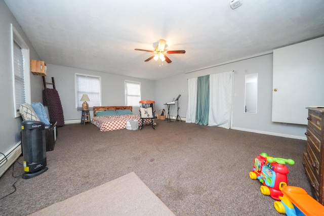 3922 Union St, Levant, ME 04456 - bedroom featuring carpet floors, ceiling fan, and a baseboard radiator