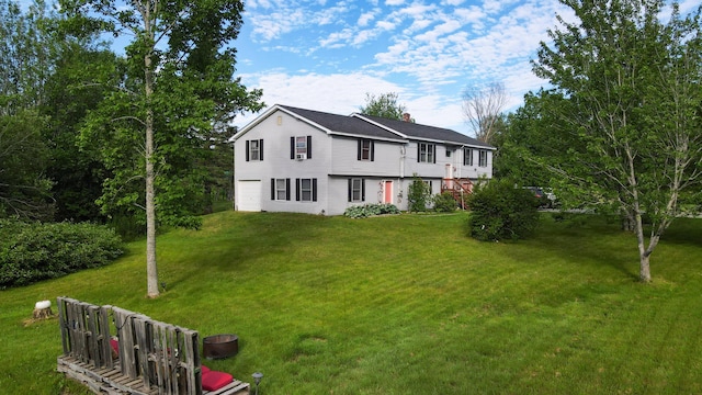 3922 Union St, Levant, ME 04456 - colonial inspired home with a chimney, a front lawn, and an attached garage