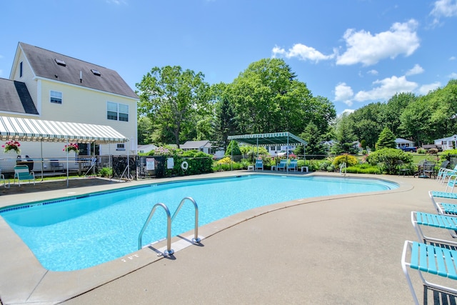 76 Post Rd Unit 17M & 18M, Wells, ME 04090 - community pool featuring a patio and view of wooded area