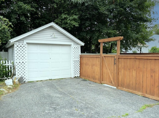 6 Shirley Ave, Lewiston, ME 04240 - detached garage with driveway and a gate