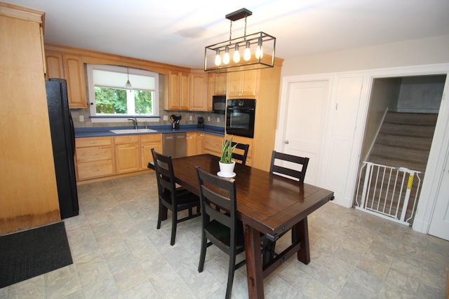 6 Shirley Ave, Lewiston, ME 04240 - kitchen with black appliances, light brown cabinets, decorative light fixtures, and dark countertops