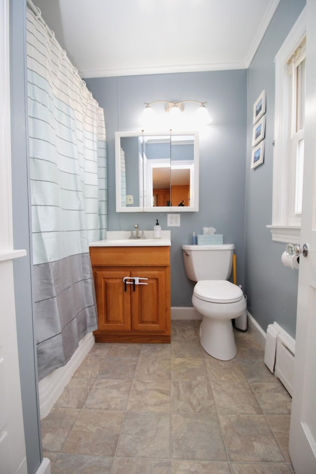6 Shirley Ave, Lewiston, ME 04240 - full bath with ornamental molding, vanity, a baseboard heating unit, and a shower with curtain