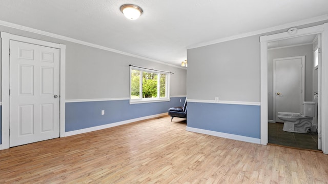 2300 Hudson Rd, Hudson, ME 04449 - empty room featuring wood finished floors, ornamental molding, and a smoke detector