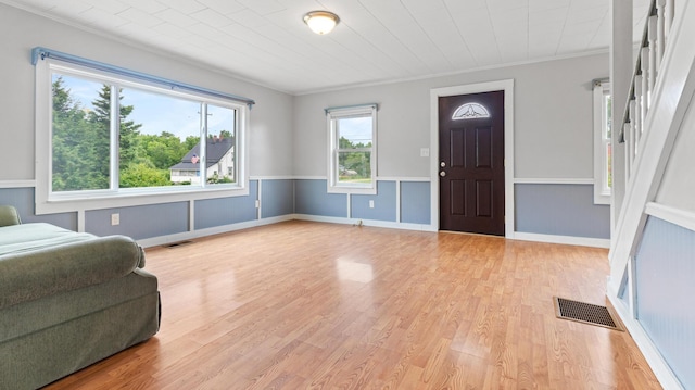 2300 Hudson Rd, Hudson, ME 04449 - foyer with light wood-style flooring and ornamental molding