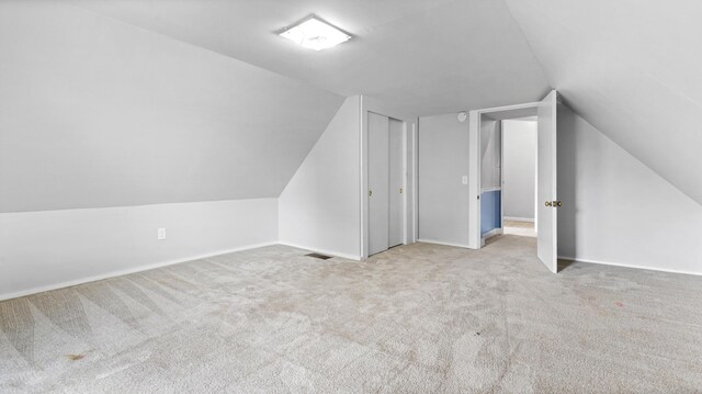 2300 Hudson Rd, Hudson, ME 04449 - additional living space featuring vaulted ceiling and carpet floors