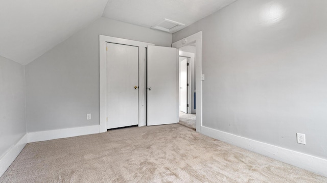 2300 Hudson Rd, Hudson, ME 04449 - unfurnished bedroom with carpet flooring, attic access, and lofted ceiling