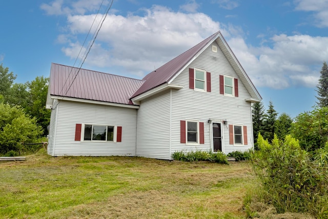 2300 Hudson Rd, Hudson, ME 04449 - rear view of house with a lawn and a metal roof