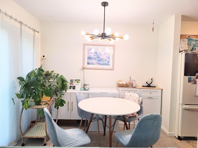 46 Glenridge Dr Unit 46, Portland, ME 04102 - dining space with a chandelier and baseboards