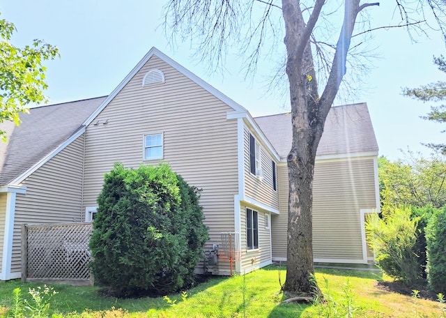 46 Glenridge Dr Unit 46, Portland, ME 04102 - view of side of property featuring a yard and a shingled roof
