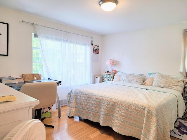46 Glenridge Dr Unit 46, Portland, ME 04102 - bedroom with light wood-style floors, multiple windows, and a desk