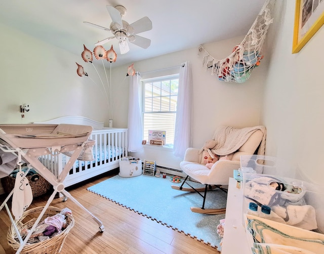 46 Glenridge Dr Unit 46, Portland, ME 04102 - bedroom featuring wood finished floors, a ceiling fan, and a nursery area