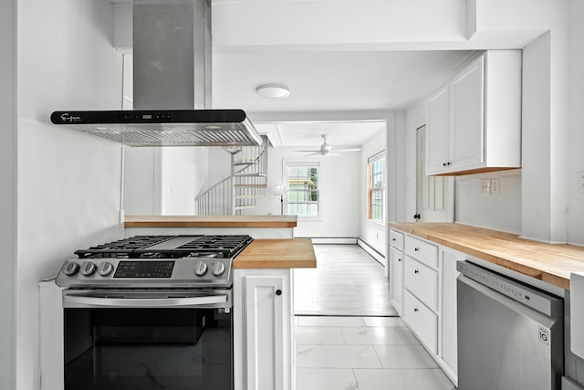 3 Gedney St, Augusta, ME 04330 - kitchen featuring butcher block counters, appliances with stainless steel finishes, wall chimney range hood, white cabinetry, and ceiling fan