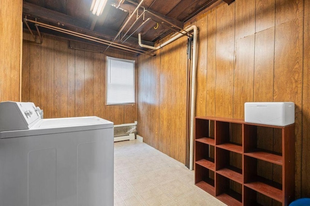 99 Hill St, Biddeford, ME 04005 - washroom with wood walls, tile patterned floors, washer and clothes dryer, and a baseboard heating unit