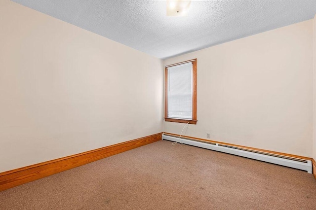 99 Hill St, Biddeford, ME 04005 - carpeted spare room featuring baseboard heating and a textured ceiling