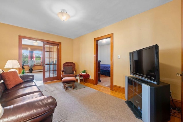 99 Hill St, Biddeford, ME 04005 - living room with french doors, wood finished floors, and carpet floors