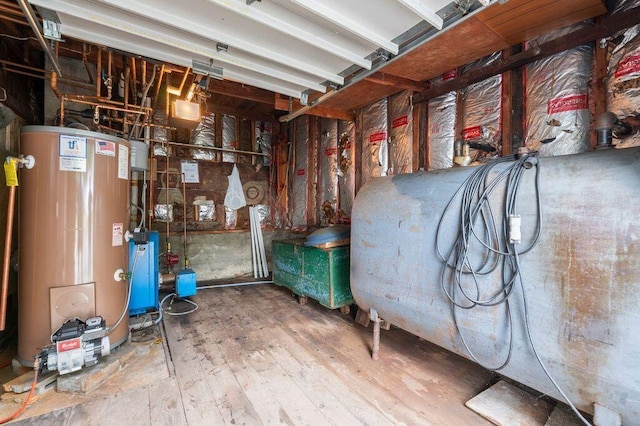 99 Hill St, Biddeford, ME 04005 - utility room featuring water heater and heating fuel