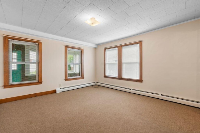 99 Hill St, Biddeford, ME 04005 - spare room featuring crown molding, carpet flooring, and a baseboard radiator
