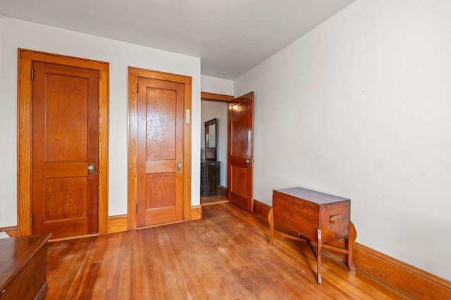 99 Hill St, Biddeford, ME 04005 - unfurnished bedroom featuring wood finished floors and baseboards