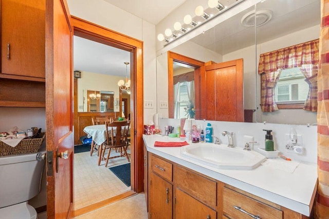 99 Hill St, Biddeford, ME 04005 - bathroom featuring vanity and a chandelier
