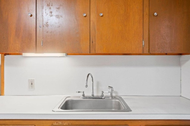 99 Hill St, Biddeford, ME 04005 - kitchen featuring light countertops and brown cabinetry