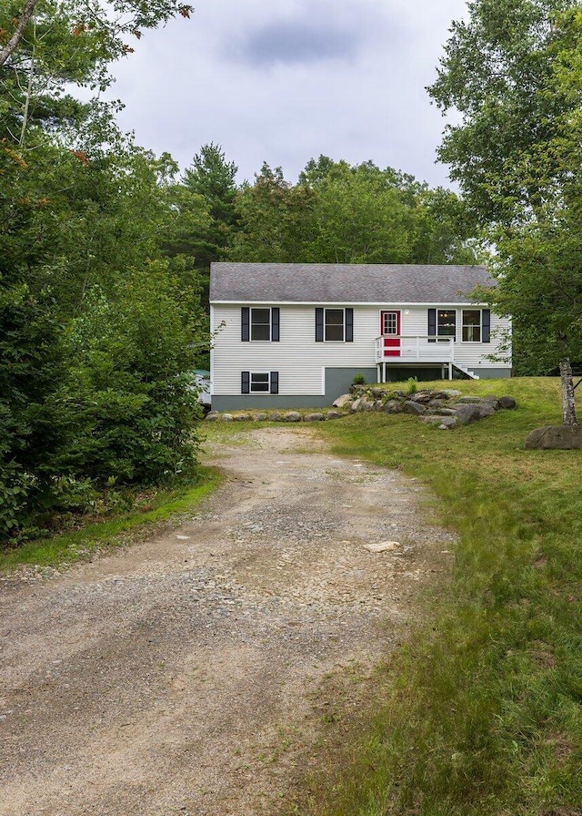 7 Lucas Ct, Bristol, ME 04539 - ranch-style home with driveway and a forest view