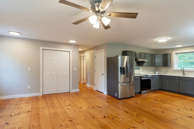 7 Lucas Ct, Bristol, ME 04539 - kitchen with stainless steel appliances, light wood-style floors, a ceiling fan, light countertops, and gray cabinetry