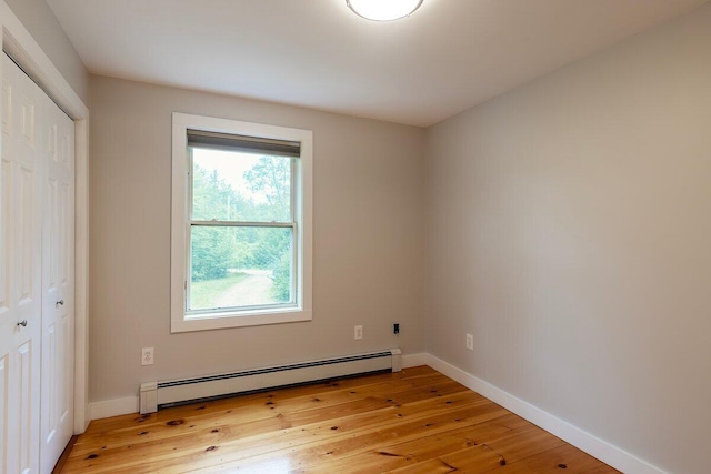 7 Lucas Ct, Bristol, ME 04539 - unfurnished bedroom with a baseboard radiator, light wood-type flooring, and a closet