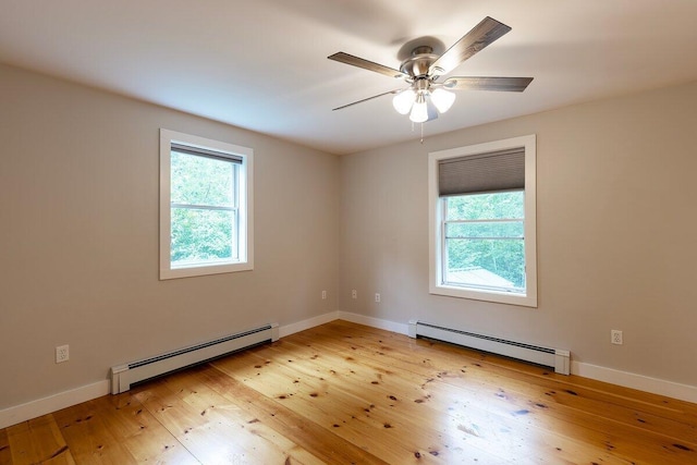 7 Lucas Ct, Bristol, ME 04539 - unfurnished room featuring a baseboard heating unit, healthy amount of natural light, and light wood-type flooring